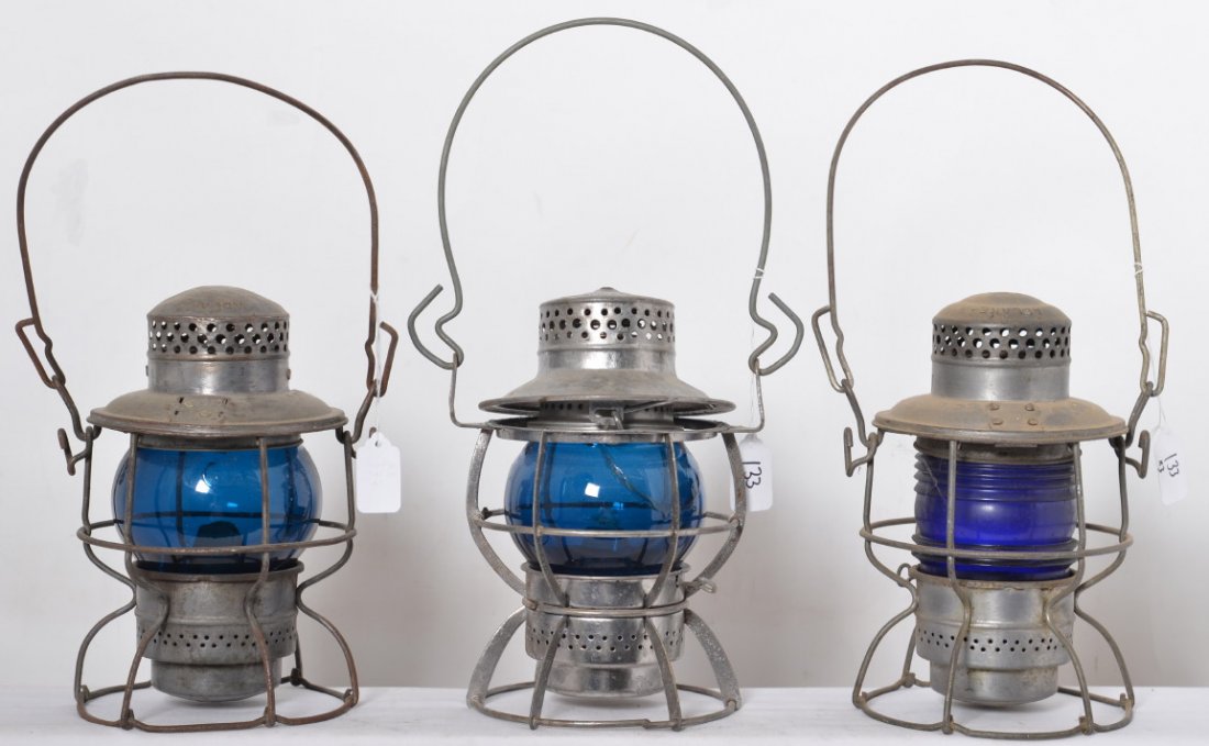 Three blue globe lanterns CSW, PRR, Erie: Three blue globe lanterns including Dressel Erie Lackawanna with repaired Adlake Kero globe and EL stamped into the top. Adlake Kero with Pennsylvania Keystone on the top, and Adlake Kero with C.S.W. 