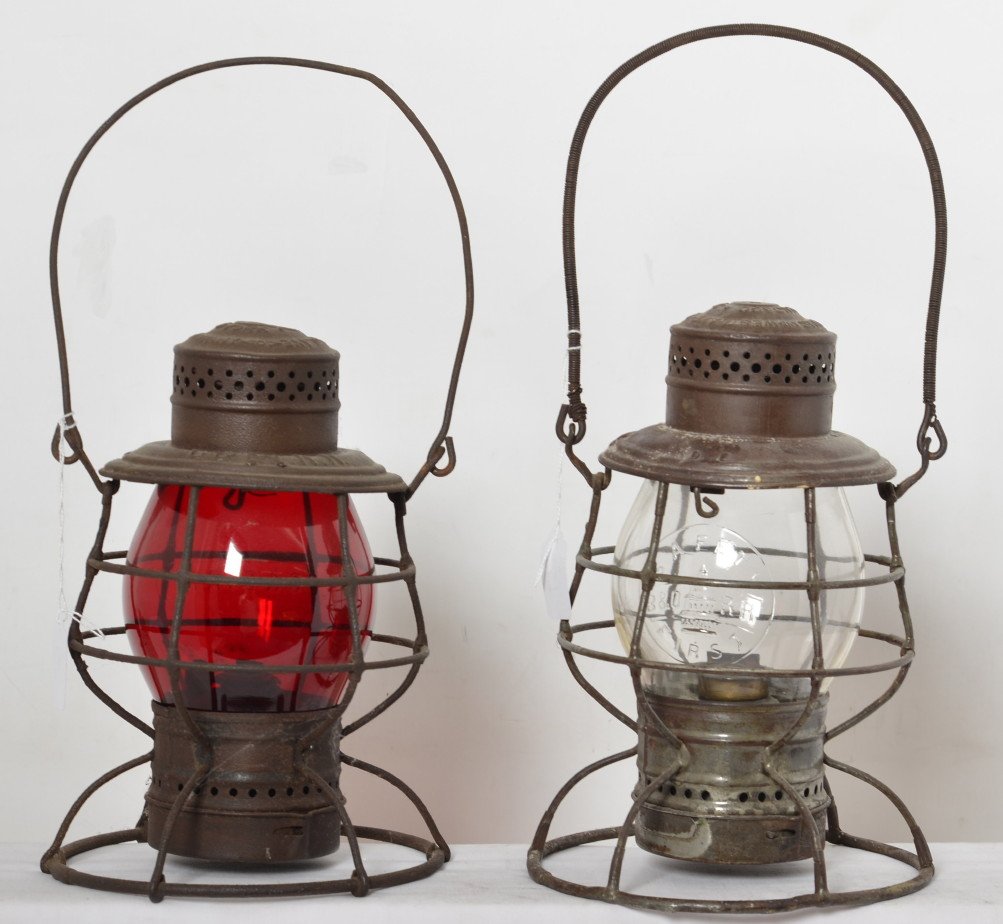 Adlake B&O and C&EI wide base lanterns: Two Adlake railroad lanterns. The first is a Baltimore and Ohio wide base double guard with B&O RR stamped in the top and clear globe with B&O Safety First and capitol dome embossed into the globe. Se
