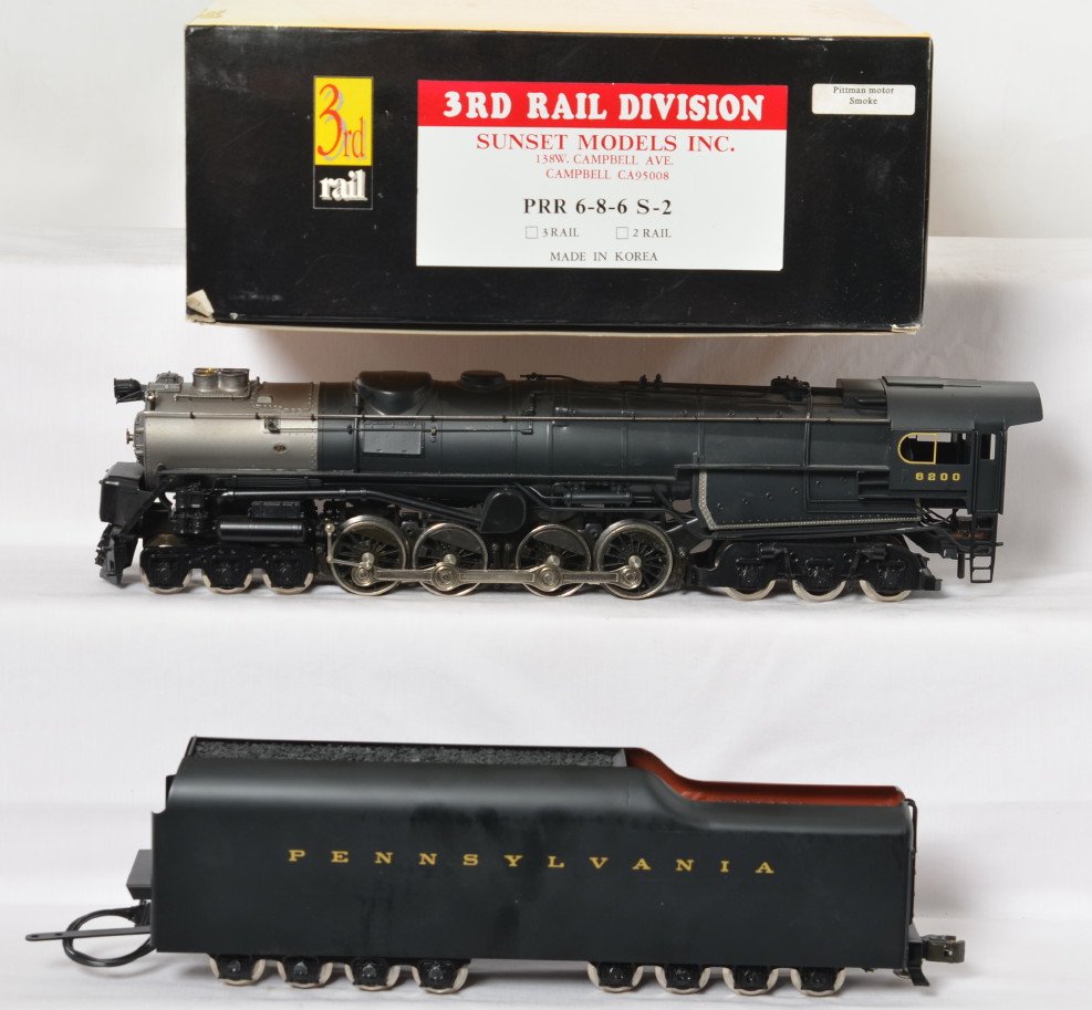 3rd Rail Pennsylvania S-2 turbine: 3rd Rail modern brass O Gauge Pennsylvania S-2 steam turbine in OB. Three rail version. Loco features electronic reverse. Loco is C7 condition with slightly bent pilot and some glossy rub spots and li