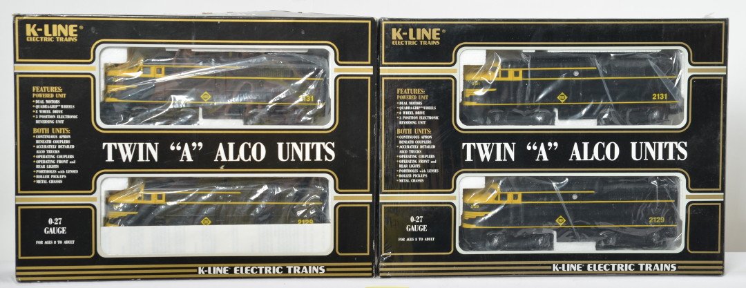 2 sets of K Line Erie Alcos: K Line modern O gauge Erie K-2129 Alco A-A sets in OBs. One set is C8 with run time, the other is sealed C10. Both OBs have some light corner wear.