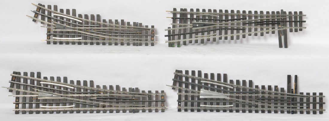4 Ross / Curtis switches: Four modern O gauge switches from Ross and Curtis. Includes three right hand, two of which are wide radius and the third is more narrow. One left hand switch also included. These have a few bent pins,