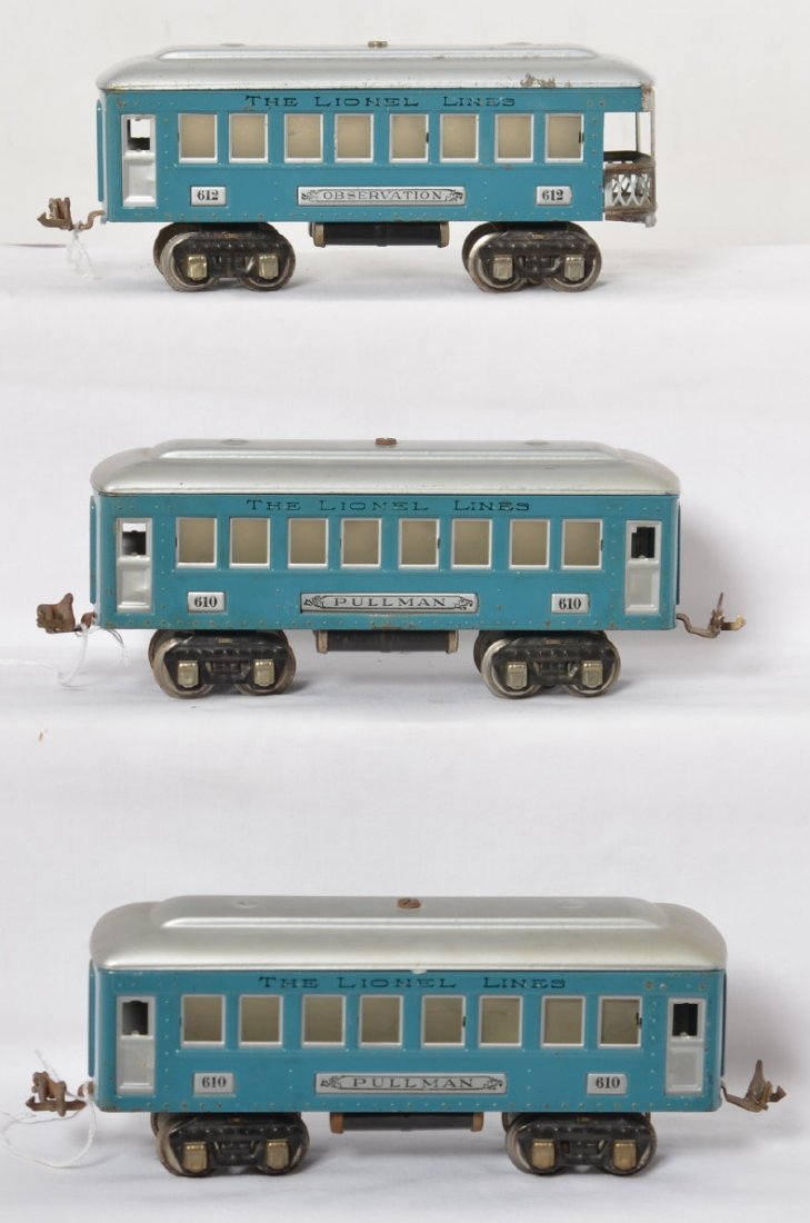 Lionel 610, 610, 612 BL illum. passenger cars: Prewar Lionel O gauge illuminated passenger cars, two 610 Pullman coaches, and a 612 observation. Light blue bodies, silver roofs, nickel journals, air tanks, and latch couplers. Metal parts have oxid