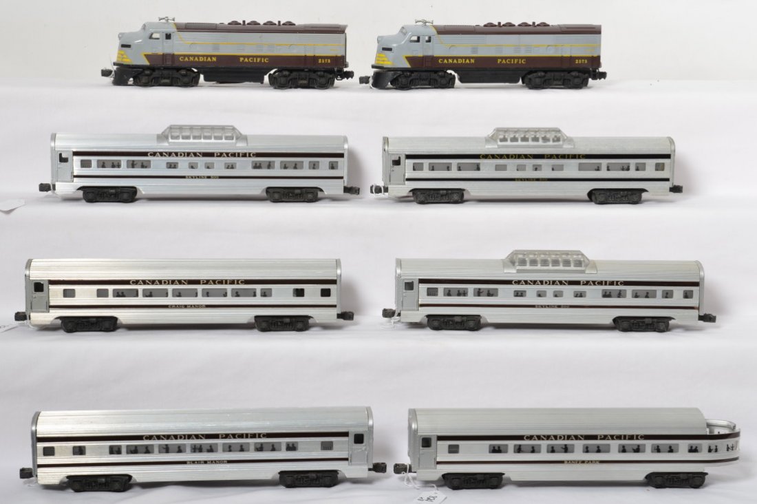 Lionel 2373 Canadian F3 A-B with six passenger cars: Postwar Lionel O gauge 2373P and 2373T Canadian Pacific EMD F3a diesel locomotives, with 2551 Banff Park observation, three 2552 Skyline 500 vista domes, 2553 Blair Manor Pullman, and 2554 Craig Manor
