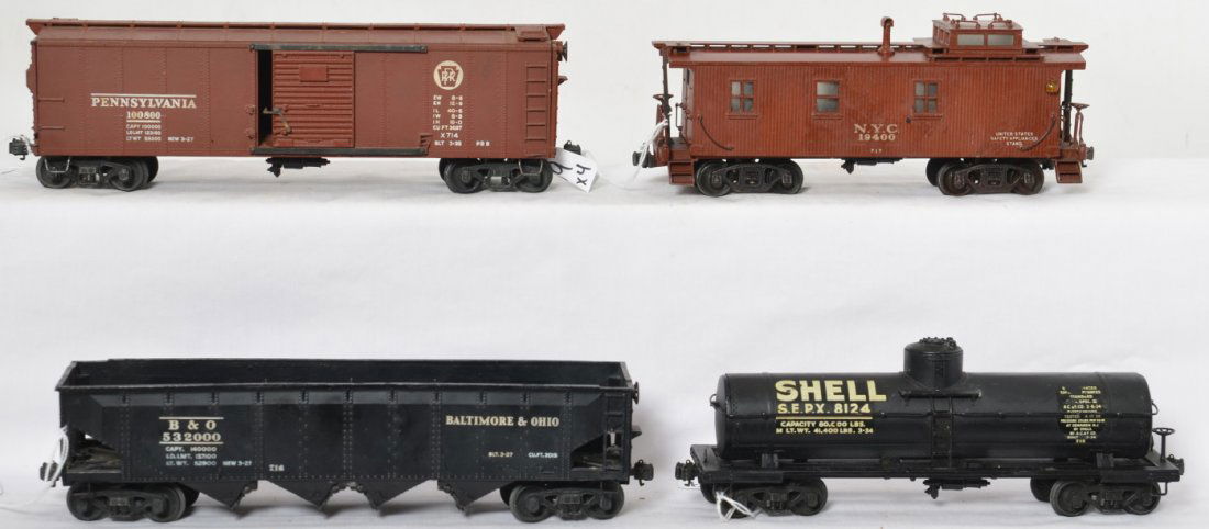 Lionel full scale freight set 714, 715, 716 and 717: Lionel prewar O gauge full scale freight cars including X714 Pennsylvania boxcar, 715 Shell tank car, 716 Baltimore and Ohio hopper and a 717 New York Central caboose. Overall the trains are in the C6