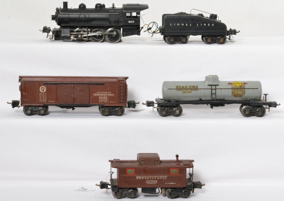 Lionel 201 switcher, 2201B, X2758, 2755, 2757X: Lionel prewar O gauge 201 steam switcher with 2201B tender, X2758 PRR auto boxcar, 2755 gray Sunoco tank car and a 2757X caboose. Loco looks nice C7 but has been renumbered and has a few touch ups. Te