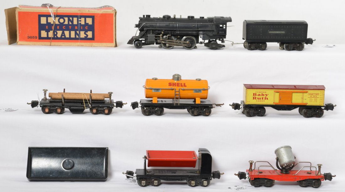 Lionel prewar 229, 2689W, 2654, 3659, 2620, 2679: Lionel prewar O gauge 229 steam loco with 2689W tender, 2654 Shell tank car, 3659 dump car with worn OB, 2620 searchlight car and a 2679 Baby Ruth boxcar. Tank is missing box for coupler and one stanc