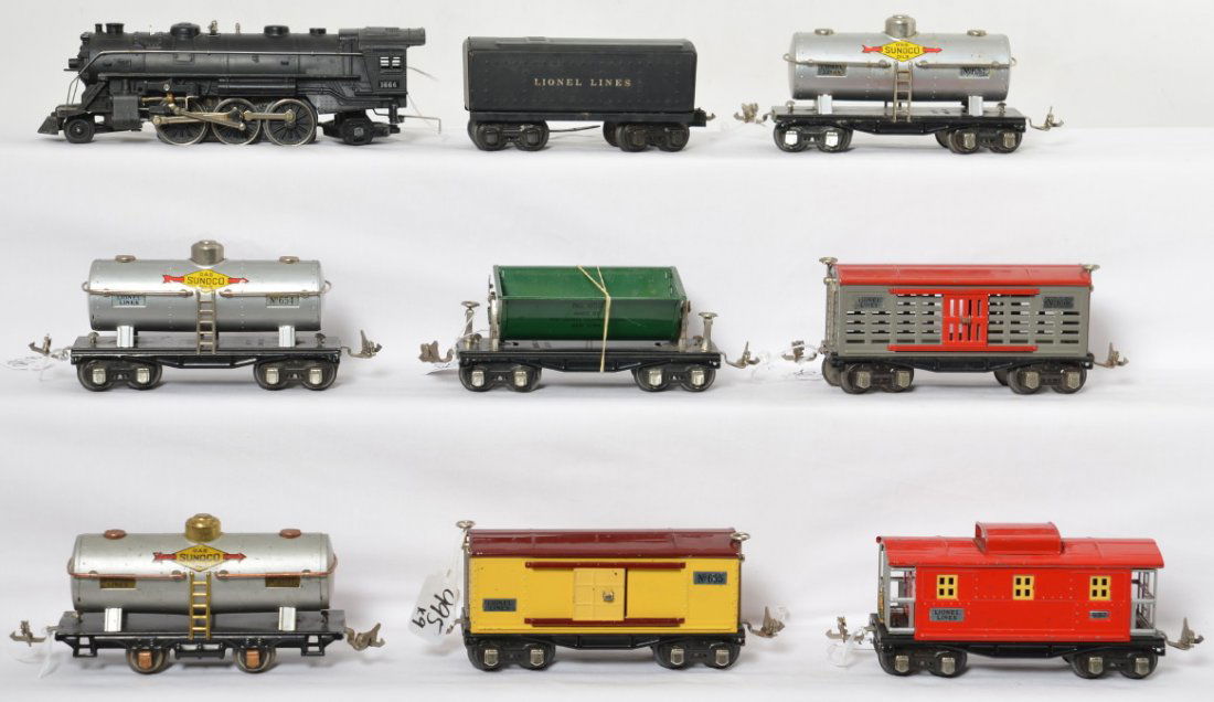 Lionel prewar 1666, 1689T, 654, 804, 656, 659, 655, 657: Lionel prewar O gauge including Lionel 1666 steam locomotive, 1689T, two 654 Sunoco tank cars, 804 Sunoco tank car, 656 gray stock car, 659 green dump car, 655 boxcar and a 657 caboose. C6-7.