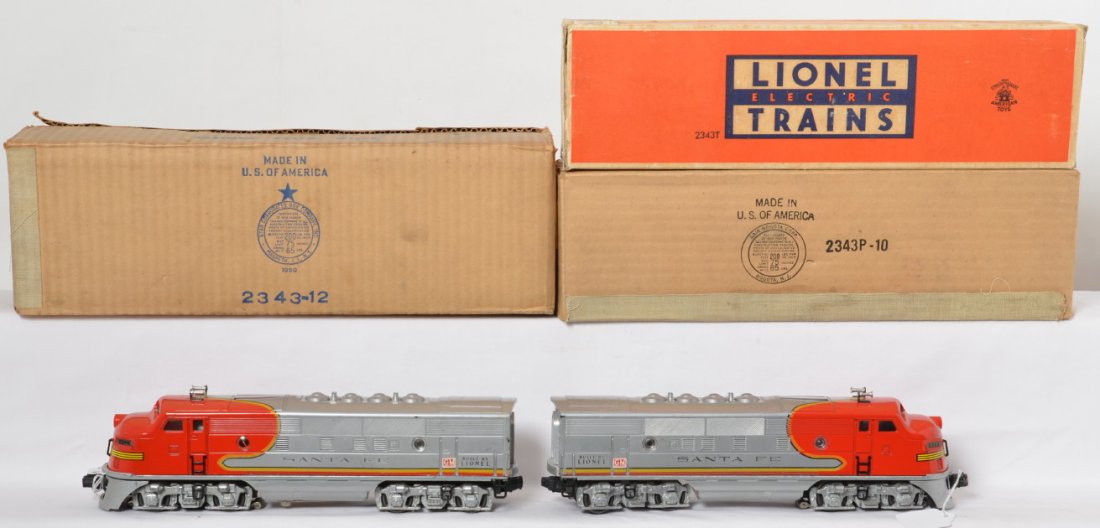 Lionel 2343 O gauge twin diesel Lionel Trains in OB: Postwar Lionel O gauge No. 2343P and 2343T twin diesel EMD F3a units in original boxes. Trains look very clean and very shiny C6+. Clean battery compartment. T box has wear and tears to flaps, Madison