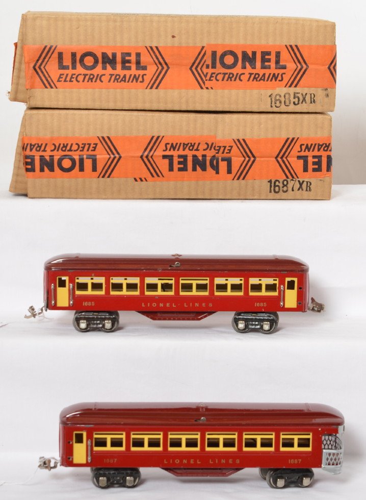 Nice Lionel 1685 and 1687 prewar cars in brick OB: Unusual Lionel postwar O gauge 1685 Pullman and 1687 observation. Two tone red, outstanding lettering. Both cars look like they should be C8-9 but one has small front corner solder repair, missing a c