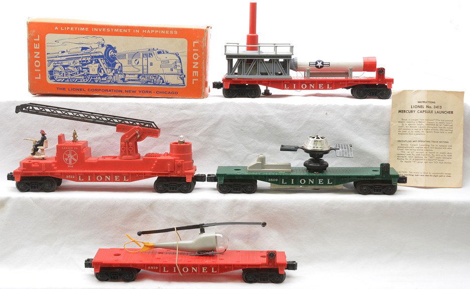 Lionel Freight Cars 3413 OB 3509 6819 3512: Lionel postwar freight cars including; 3413 Mercury capsule launching car with instruction sheet in OB, 3509 Satellite launching car, 6819 flatcar with helicopter and a 3512 fireman and ladder car. Th