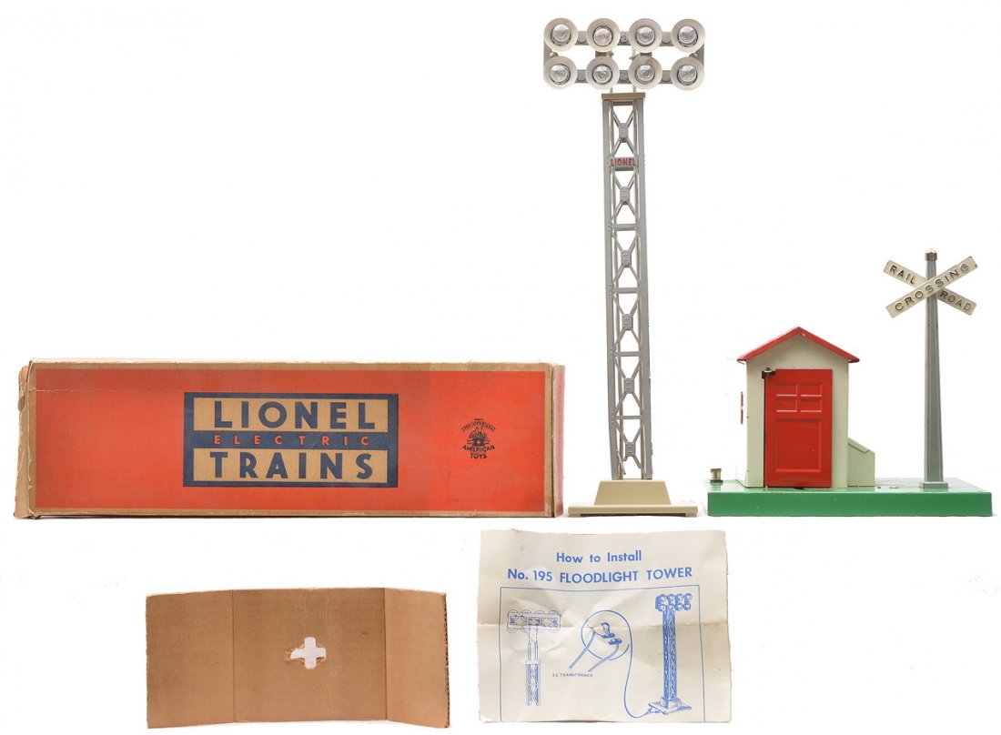 Lionel 195 Floodlight OB 45N Gateman: Lionel postwar 195 railroad yard floodlight with instruction sheet and original cardboard insert in OB, C7. The box shows some wear. Also included is a 45N gateman, C6.