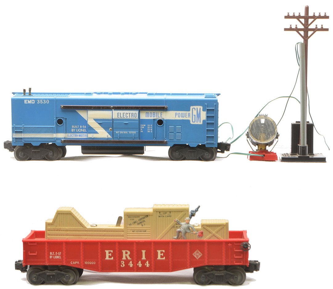 Lionel 3530 GM Generator 3444 Cop & Hobo: Lionel postwar 3530 GM generator car with searchlight, pole and base. This is the version with the black tanks. Generator car is C7. Also included is a 3444 Erie operating cop and hobo gondola, C7-8.