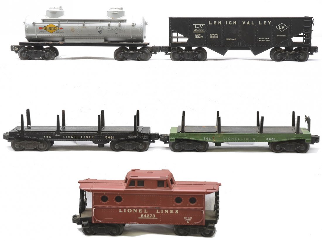 Lionel Freights 6456 3461 3461 6465 6427: Lionel postwar freight cars including; 6456 black Lehigh Valley hopper, 3461 green operating log dump missing the logs, 3461 black operating log dump car missing the logs, 6465 silver Sunoco two dome 