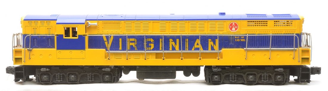 Lionel 2331 Virginian FM Train Master Diesel: Lionel postwar 2331 Virginian FM Train Master diesel the version with an unpainted blue body and yellow painted stripes. There is a screw hole crack on one end of the diesel. The diesel has a couple o