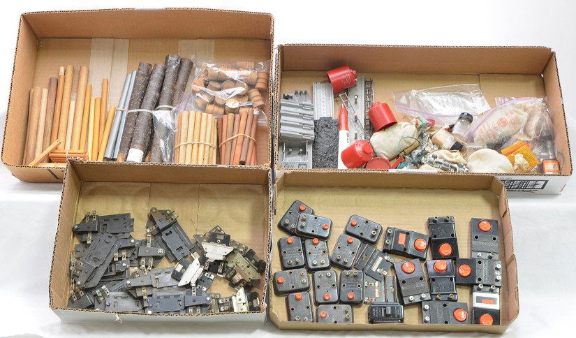 Lionel Postwar Selection of Accessories & Parts: Lionel postwar selection of parts and accessories including; logs, plastic canisters, barrels, timber, plastic pipes, coal load, smoke pellets, ladders, 153C contactors, 154C contactors, 90 and 96C co