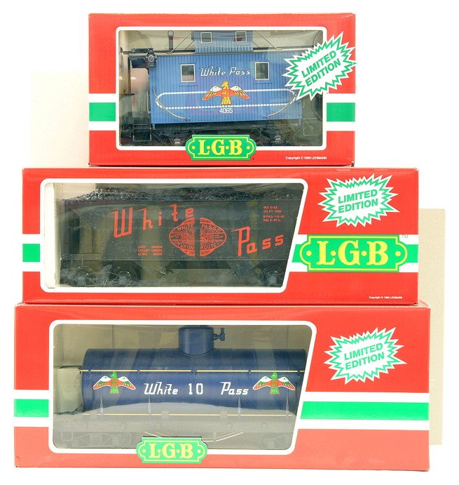 LGB White Pass 4080-W01 4076-W02 4065-W03: LGB G scale Limited Editions White Pass & Yukon freight cars including; 4080-W01 single dome tank, 076-W02 hopper with coal load, and a 4065-W03 caboose all in OBs with outer sleeves. Cars have never