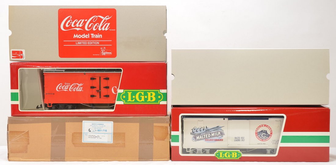 LGB Limited Edition 46670 Coors 4072 Coke MIB: LGB G scale Limited Edition 46670 Coors Malted Milk boxcar Collectible Serial no. 0064 and a 4072 Coca Cola refrigerator car both in OBs with outer sleeves. The 46670 has an outer shipping carton. Car