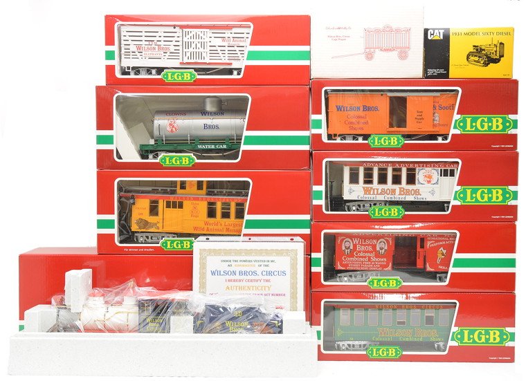 LGB Wilson Bros. Circus Set w/Engine & Cars: LGB G scale Wilson Bros. Circus set with Certificate of Authenticity no. 0064. Circus set consists of the following components: 24192 steam engine and tender, 3084-DG advertising car no. 1, 3080-DG Pe