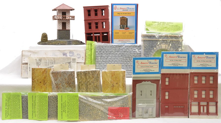 Selection of Building Kits and Scenery: Ameri-Towne by Buildings Unlimited O gauge kits including; 872 Bills Store, 67 Flicker Theater, 70 back wall and 75 Plain Jane Cafe. The 872 is in an OB, C7. The other three kits are factory sealed in