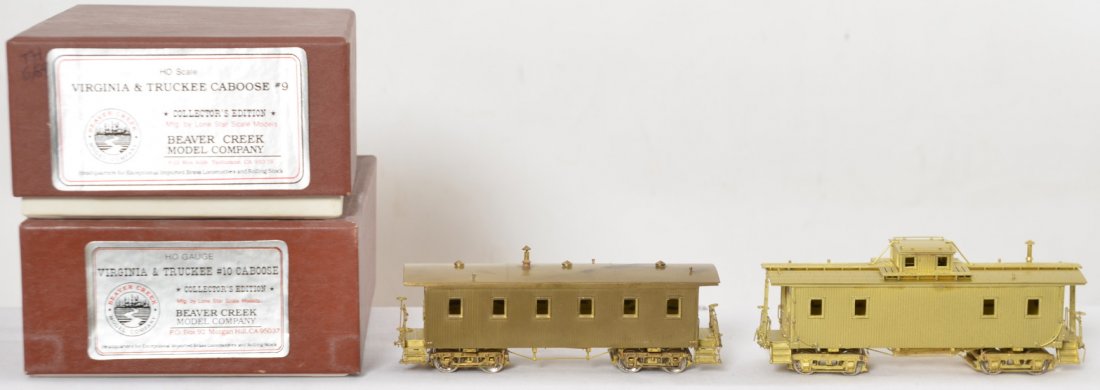 Two Beaver Creek brass V&T cabooses #9 #10: Beaver Creek modern HO brass Virginia and Truckee cabooses in OBs. Includes #9 and #10. Boxes have some light moisture discoloration. #10 caboose has some light discoloration of the brass starting to 