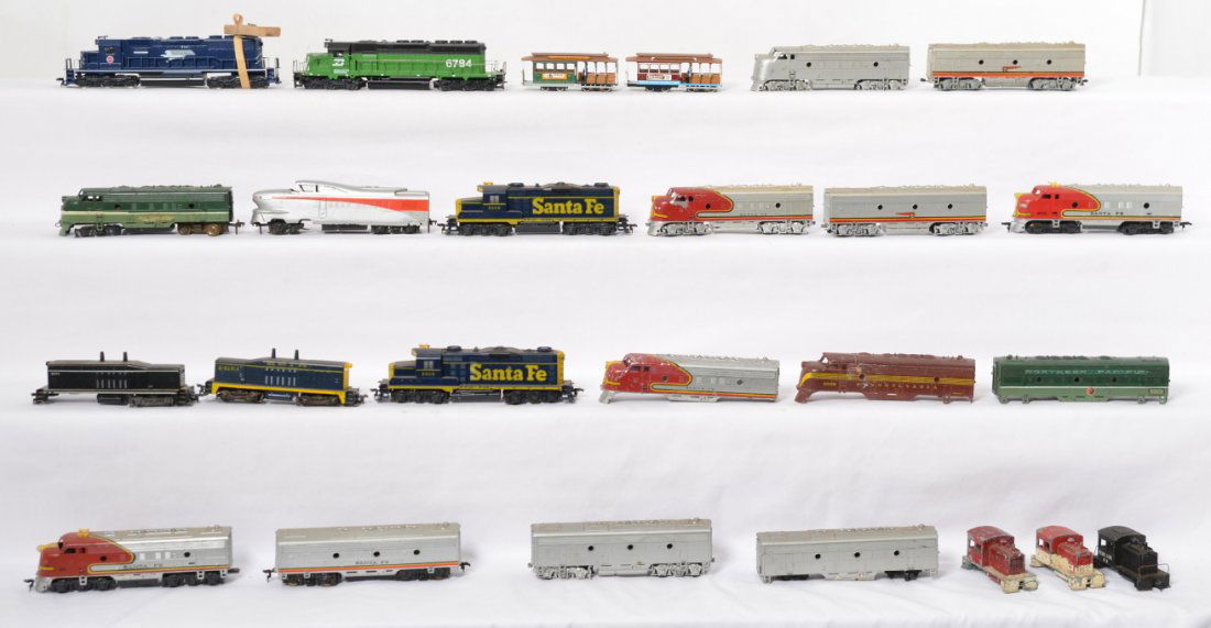 24 HO locomotives, shells, trollies, etc: Large box of twenty five HO locomotives, shells, etc. mix of powered and unpowered. See photos for best description.