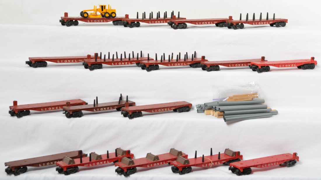 Lionel 6825, 6264 x3, 6311 x2, 6511 x10, one unnumbered: Postwar Lionel O gauge lot of 17 flatcars, one unnumbered, 6825, three 6264, two 6311, and ten 6511. Some have stakes, some have pipes, some have logs, some have timbers, etc. Some melt/glue marks, lo