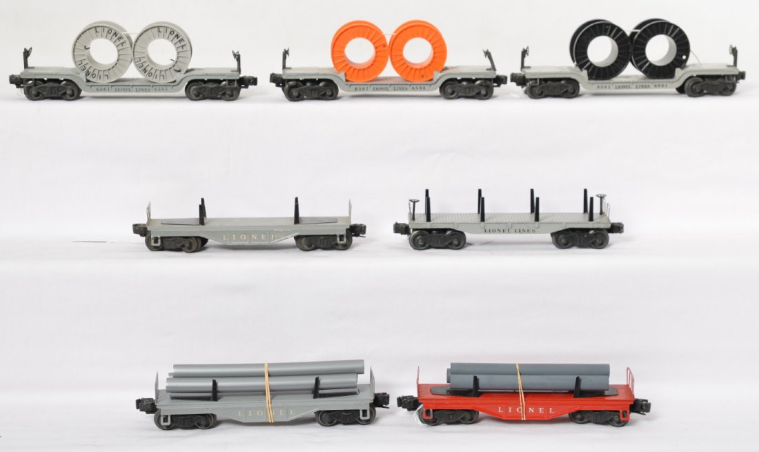 Lionel 2411, 6111 x3, and 6561 x3, flatcars: Postwar Lionel O gauge 2411, three 611, and three 6561 flatcars with some loads, C6.