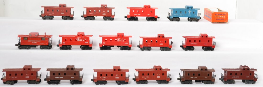 Fifteen Lionel cabooses, 6017-100 in OB, 6357, 6257...: Postwar Lionel O gauge cabooses, C6-7. Three 6017, 6047, two 6059, four 6257, two 6357, 6167, 2457, and 6017-100. OB for 6017-100 is missing display panel and flaps.