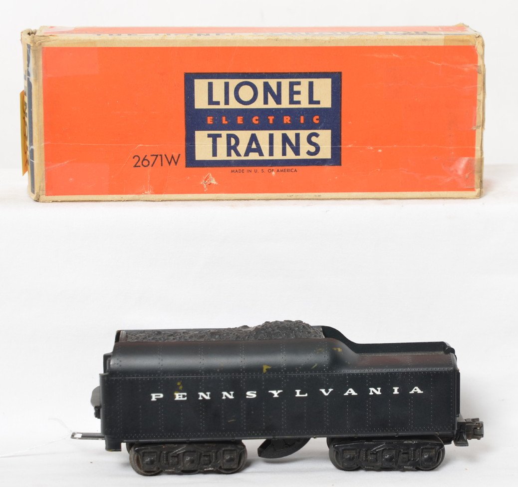Lionel 2671W tender with whistle, PRR w/backup: Postwar Lionel O gauge 2671W tender with whistle, Pennsylvania with backup light, C6+. Box has missing inner flap, tape repairs, one end taped shut.