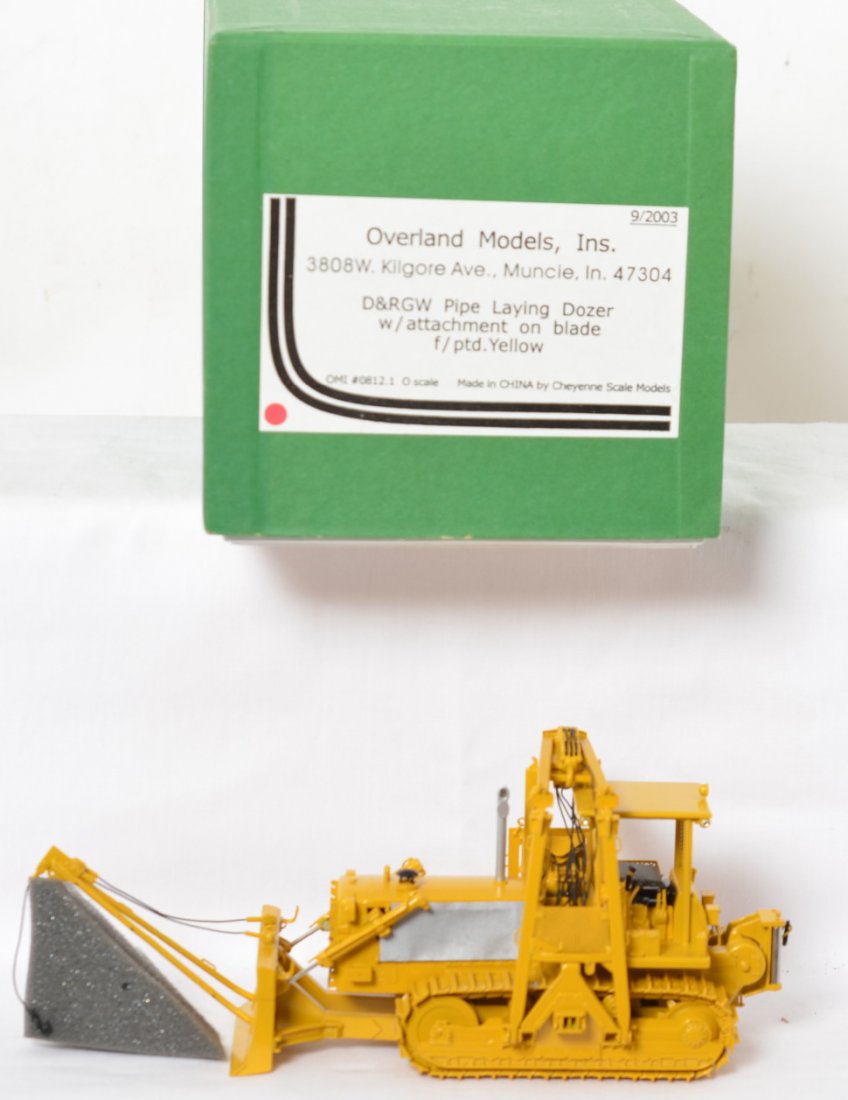 Overland Models Rio Grande brass pipe laying dozer: Overland Models modern O scale brass Denver and Rio Grande Western pipe laying bulldozer with attachment on blade. Dozer is factory painted and is C9 condition.