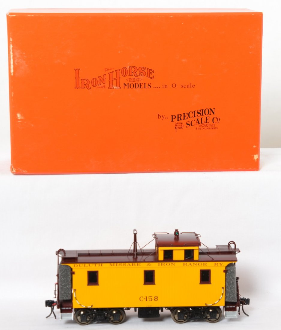 Precision Scale Co. Duluth Missabe caboose 16847-1: Precision Scale Co. O scale two rail Duluth Missabe and Iron Range brass wood side caboose in OB. Precision Scale Co. number is 16847-1 Caboose is C8+. OB has some light corner wear.