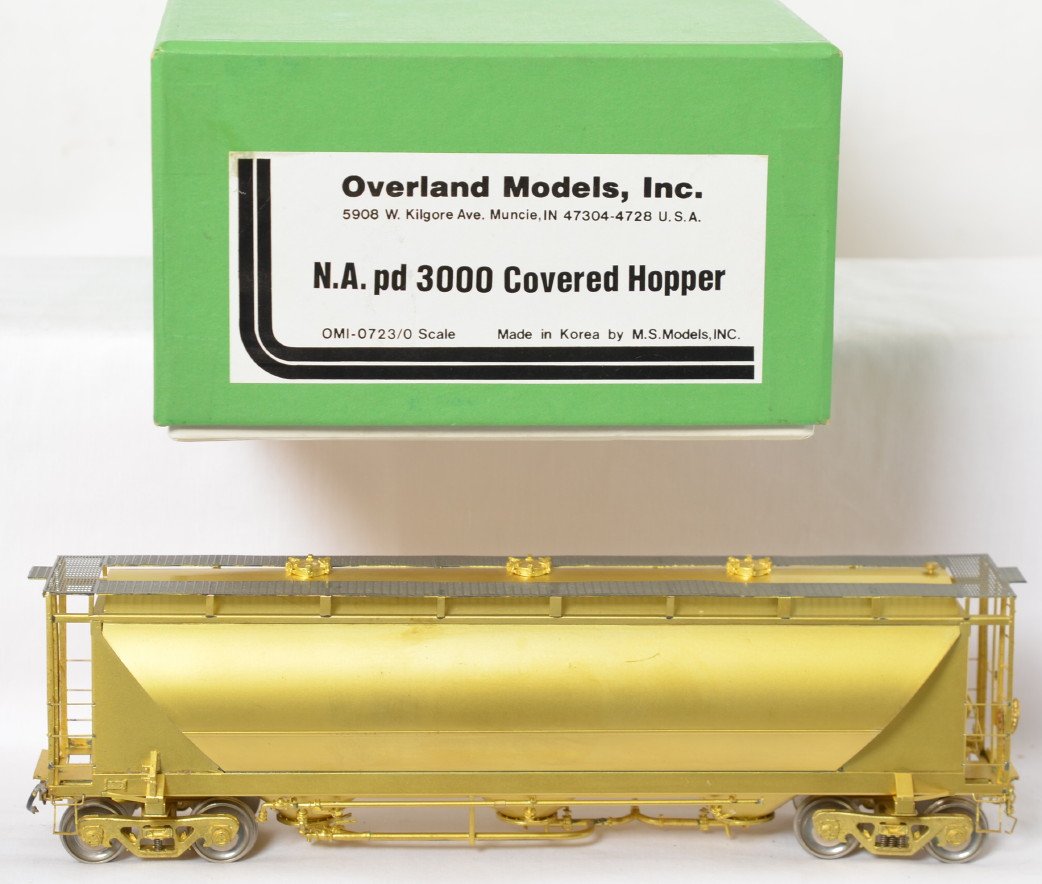 Overland Models unpainted covered hoppers: Overland Models modern O scale two rail brass OMI-723 North American pd 3000 covered hopper in OB. Model is unpainted and is C7-8 condition with one half inch scratch and some light tarnish on the und