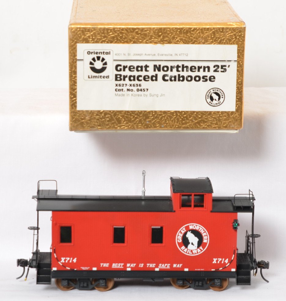 Oriental Limited Great Northern 25Í braced caboose: Oriental Limited modern brass O scale two rail Great Northern 25Í braced caboose in OB. Caboose is factory painted in C8 condition. OB has some light wear.