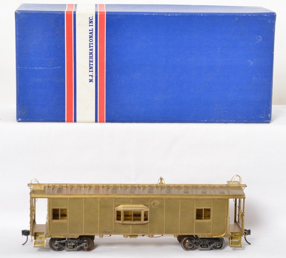 NJ Custom Brass New York Central bay window caboose: NJ Custom Brass modern O scale two rail 667-0 New York Central bay window caboose in OB. Caboose is C7+ with some light spots of tarnish forming on the roof and and one pinky nail sized spot forming o