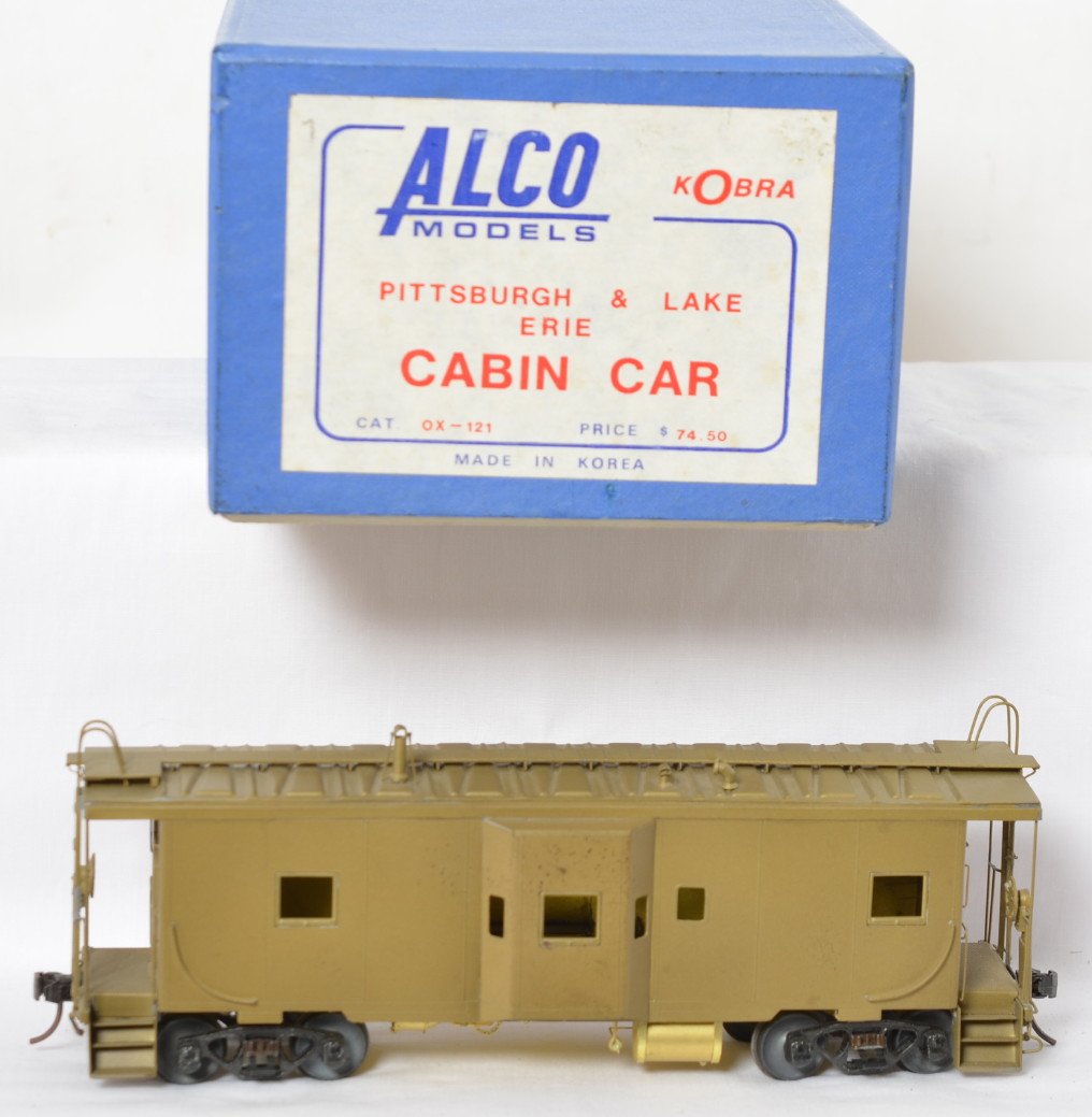 Alco Models Pittsburgh & Lake Erie caboose: Alco Models modern two rail O scale brass OX-121 Pittsburgh & Lake Erie cabin car caboose in OB. Caboose is C7 with some darkening of the brass and light tarnish spotting.