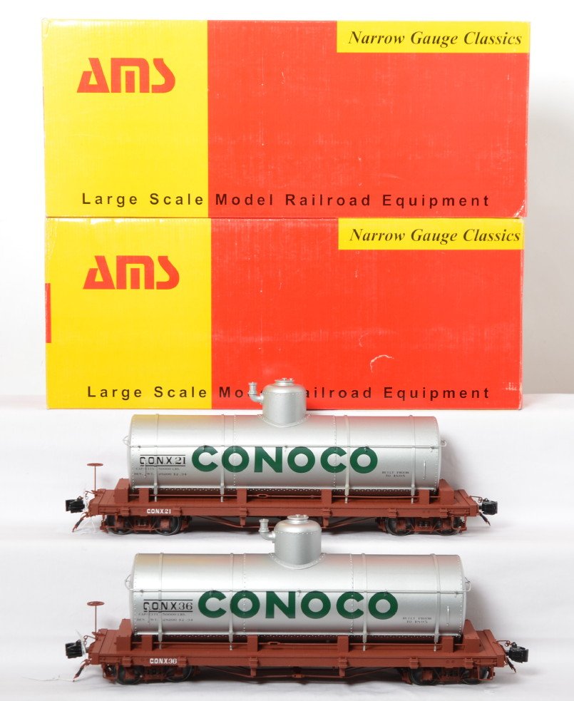 AMS Accucraft AM31-310 G scale tank car 2-pack in OB: Modern era AMS Accucraft G scale/1 gauge AM31-310 Conoco tank car 2-pack in original boxes. AM31-422 #21 and AM31-423 #36. Trains look C8-9 with run time. Boxes show little wear, in shipper.