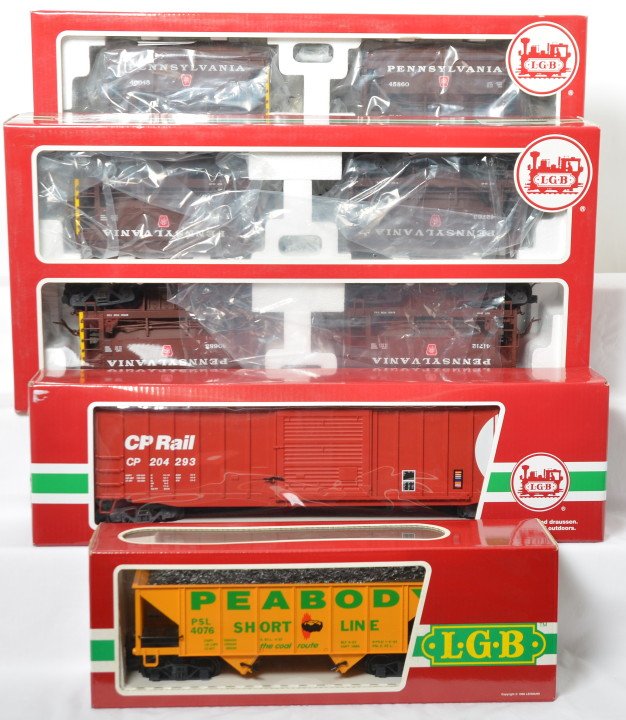 LGB 40040, 40045, 42930, and 4076 freight in OB: Modern era LGB G scale/1 gauge freight cars in original boxes, C8-9 with light run time. 40040 Pennsylvania ore car 4 pack, 40045 Pennsylvania ore car 4 pack, 42930 CP Rail boxcar, and 4076 Peabody co