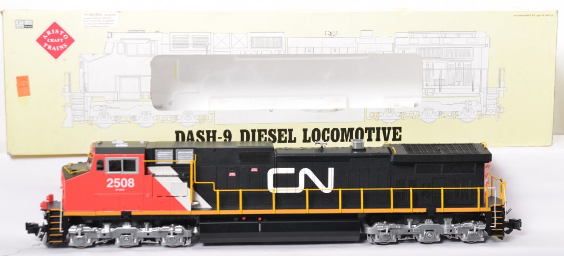 Aristo-Craft ART-23908 Canadian National DASH-9 in OB: Modern era Aristo-Craft G scale/1 gauge ART-23908 Canadian National DASH-9 diesel locomotive in original box with loose and unattached trim that needs reglued. Trains otherwise look C8 area with light