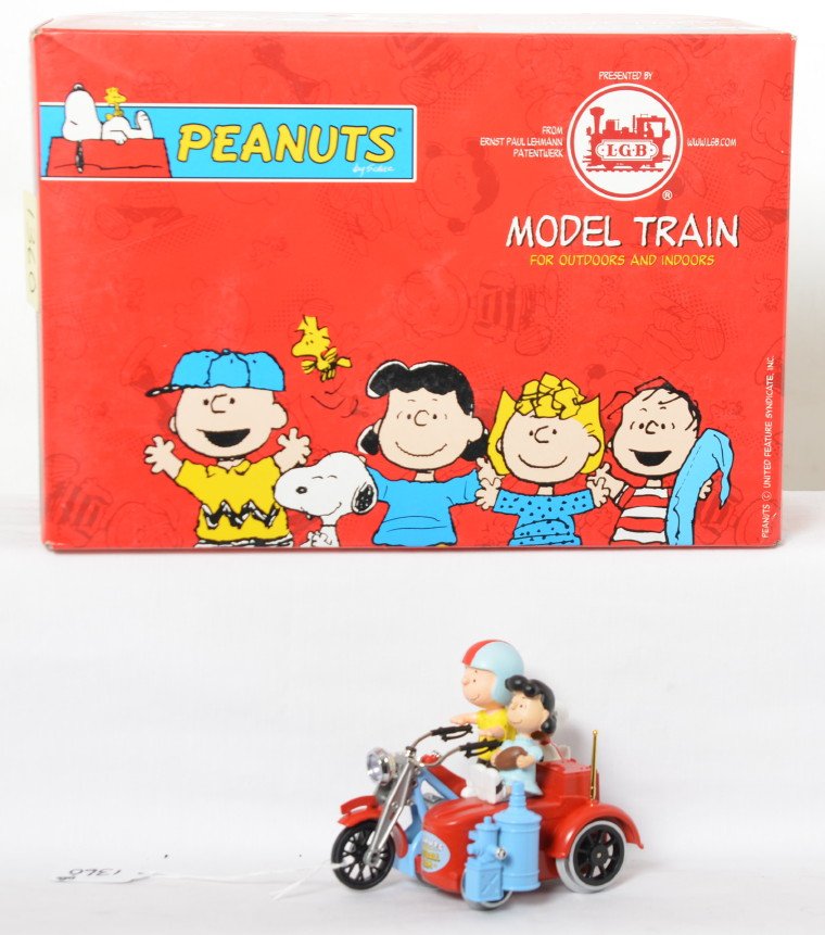 LGB 22030 Peanuts motorcycle w/sidecar in OB: Modern era LGB G scale/1 gauge 22030 Peanuts motorcycle with side car, featuring Charlie Brown, Lucy, Snoopy, and Woodstock (still in bag). Train appears to have been run, C8-9. Box includes instructi