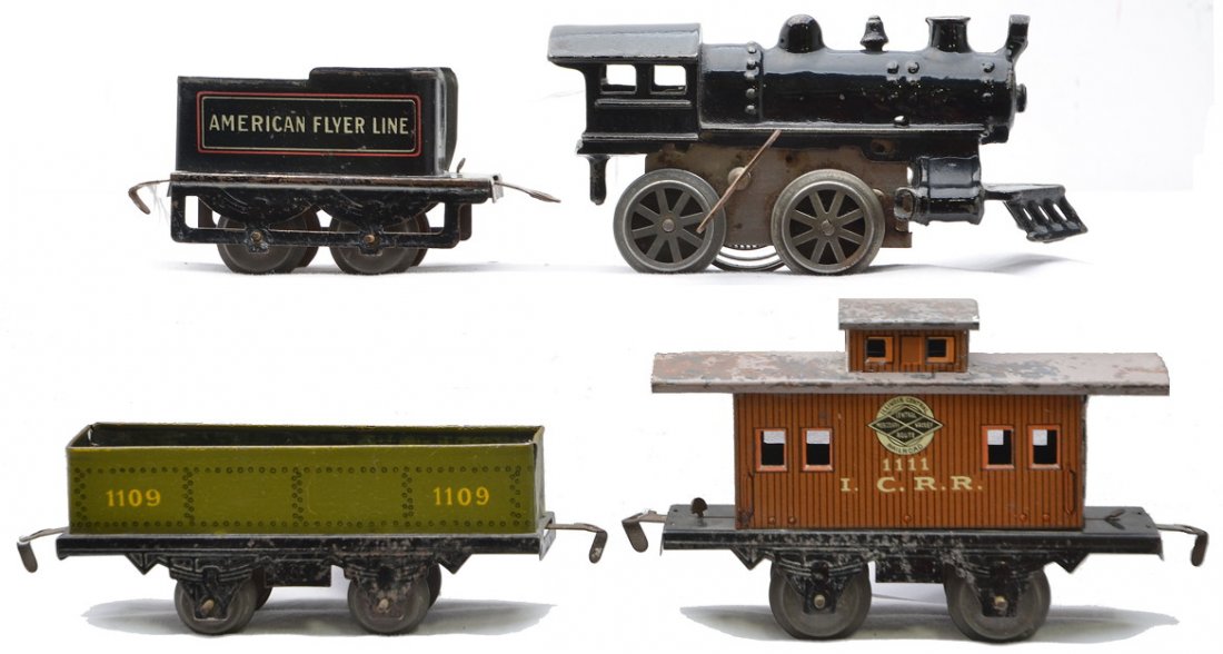 AF Prewar No. 0 Loco 120 Tender 1109 1111 ICRR: American Flyer prewar O gauge lithographed freight set with 5 1/2 inch four-wheel freight cars including; No. 0 clockwork black cast iron 0-4-0 locomotive, 120 tender, 1109 sand car and 1111 I.C.R.R. 