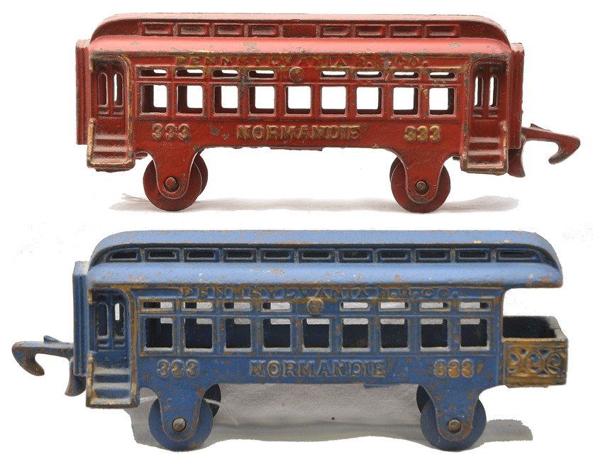 Hubley Floor Toy PRR Normandie 333 Pass Cars: Hubley cast iron floor toy passenger cars including; 333 red coach and a 333 blue observation. Both cars are lettered PENNSYLVANIA RR CO above the windows and NORMANDIE below the windows and have gold