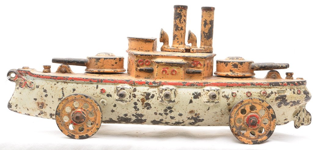 Vintage Cast Iron Floor Toy War Ship Mfg. Unknown: Vintage cast iron floor toy war ship which measures 12 inches in length, manufacturer unknown. The ship has heavy paint flaking and is C5.