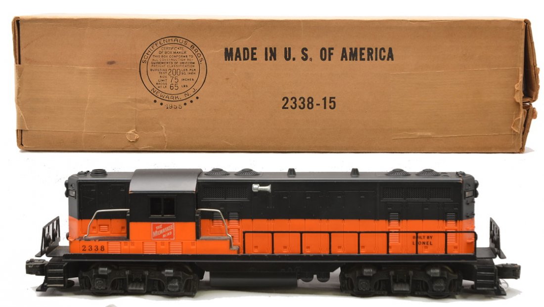 Lionel 2338 MR GP7 Diesel Solid Orange Band OB: Lionel postwar 2338 Milwaukee Road GP7 diesel in OB. This is the harder to find version with solid orange band that goes through the cab. Frame has on e scratch on the side and cab has some box rubs.