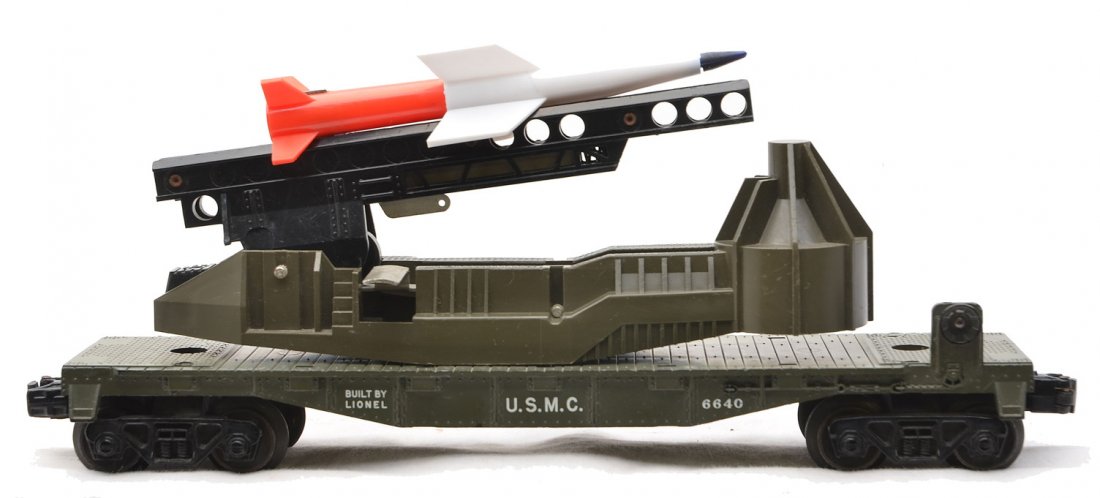 Lionel 6640 USMC Missile Launching Car: Lionel postwar 6640 olive drab U.S.M.C. missile launching car with rocket. This car only came with the Land, Sea and Air gift set no. 1805, circa 1960. The car is C7-8.