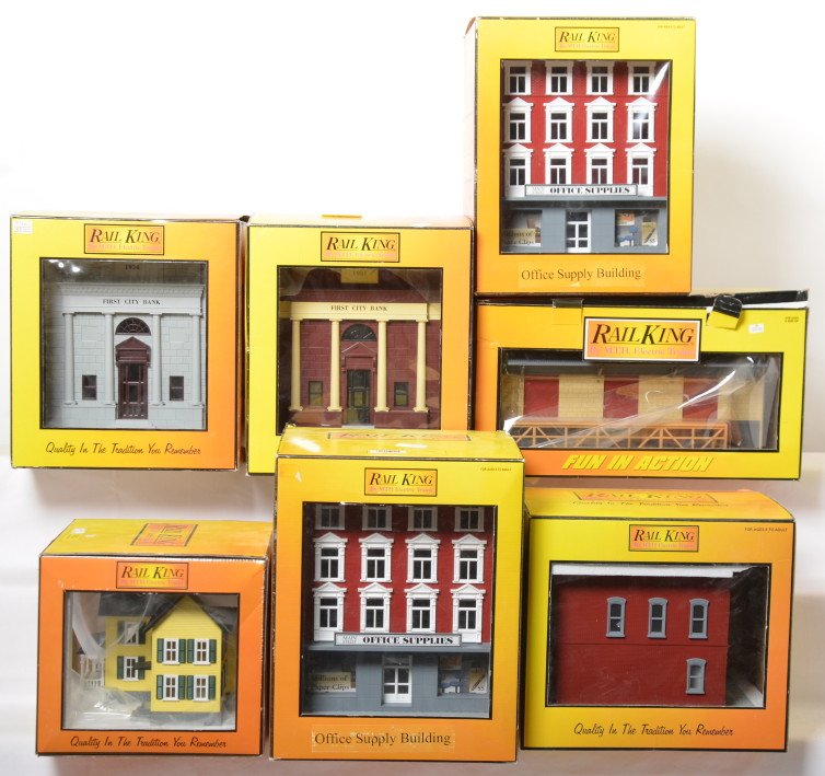7 Railking buildings warehouse, bank, drug store, etc: MTH Railking modern O gauge buildings in OBs. Seven buildings include 9012 drug store, 9007 farm house, two 9013 office supply buildings, 9075 First City bank, 9017 two tone bank, and 9098 freight tra