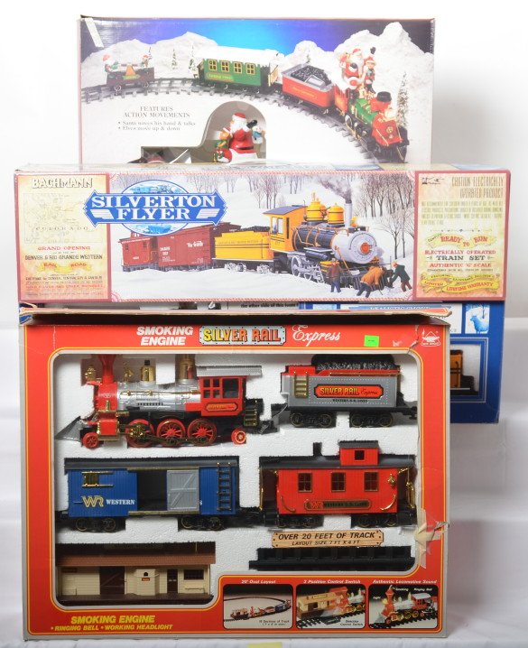 Bachmann G scale set and two battery powered sets: Modern G scale train sets includes 90025 Bachmann Silver Flyer missing track and transformer, New Brite battery powered 1170S Silver Rail Express, and Grandure Noel SantaÃ•s North Pole Express. Set