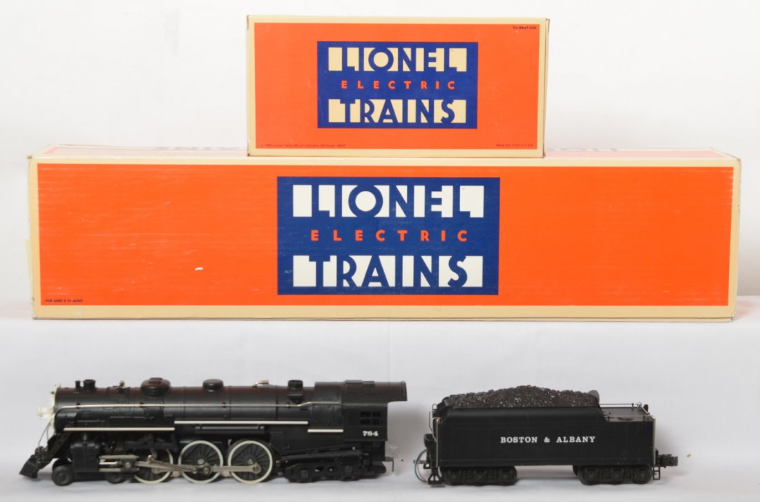 Lionel Boston & Albany Hudson and caboose: Lionel modern O gauge No. 8606 Boston and Albany 4-6-4 Hudson steam locomotive and tender with operating smoke stack and steam chests and electronic Mighty Sound of Steam. Also included is 6920 B&A ca