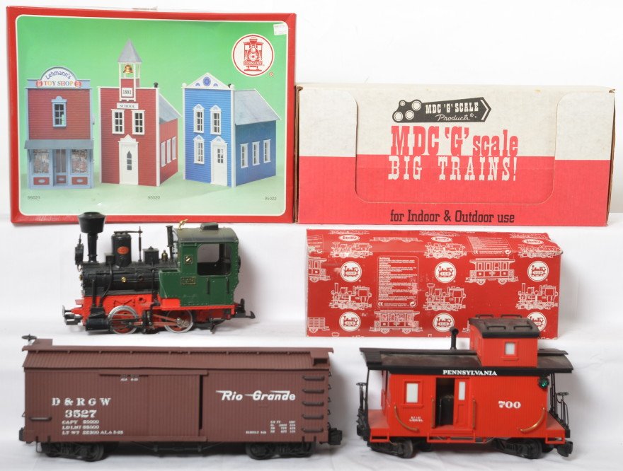 LGB loco, building, track and more: LGB modern and other G scale items. Includes 2010D steam locomotive, Bachmann Rio Grande boxcar, Lionel Pennsylvania caboose, MDC Gulch Line boxcar, 95020 LGB school building, and box of 12 1100 curve