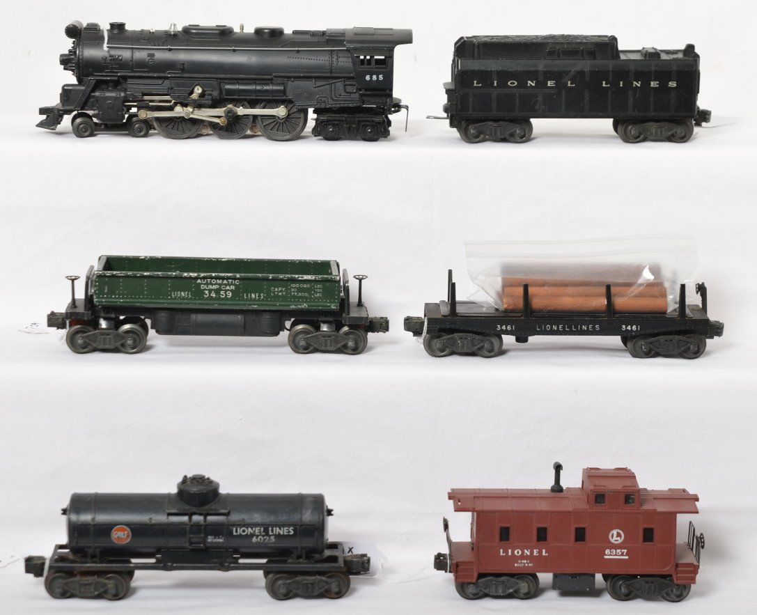 Lionel 685, tender, 3459, 3461, 6025, 6357 steam: Postwar Lionel O gauge 685 steam locomotive and whistle tender with 3459 automatic dump car, 3461 automatic lumber car, 6025 Gulf tank, and 6357 illuminated caboose. Loco has touchups, tender is missi