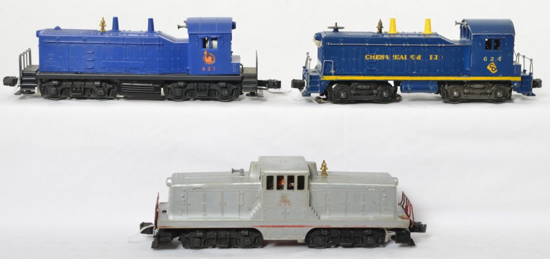 Lionel 621, 624, and 629 diesel switcher locomotives: Postwar Lionel O gauge 621 Jersey Central NW-2, 624 Chesapeake and Ohio, and 629 Burlington GE 44 ton, diesel switchers. 621 has cracked nose, 624 has dinged rear cab corners, and 629 has cracks in sh